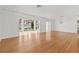 Spacious living room with hardwood floors and large windows offering natural light at 1238 Monterey Ne Blvd, St Petersburg, FL 33704