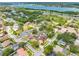 Beautiful aerial view showcasing the neighborhood's serene atmosphere and lush landscaping near the water at 12470 93Rd St, Largo, FL 33773