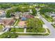 Backyard featuring a screened pool, shed, green lawn, and manicured landscaping at 12470 93Rd St, Largo, FL 33773