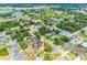 Scenic aerial view capturing the property within a charming neighborhood with mature landscaping and nearby amenities at 12470 93Rd St, Largo, FL 33773