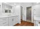Bright bathroom featuring double vanity, modern fixtures, and walk-in shower at 12470 93Rd St, Largo, FL 33773