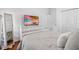 Bedroom featuring wood floors, closet, and neutral décor at 12470 93Rd St, Largo, FL 33773