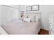 Bedroom featuring wood floors, a white headboard, and neutral décor at 12470 93Rd St, Largo, FL 33773