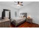 Comfortable bedroom with wood floors and a rustic, relaxing ambiance at 12470 93Rd St, Largo, FL 33773