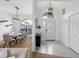 Inviting foyer with modern chandelier, offering a seamless transition to the dining area at 12470 93Rd St, Largo, FL 33773