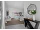 Bright foyer with tile flooring, complemented by stylish furnishings and pool view at 12470 93Rd St, Largo, FL 33773