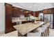 Spacious kitchen with a large island, granite countertops, custom cabinetry, and stainless steel appliances at 12470 93Rd St, Largo, FL 33773