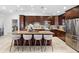 Beautiful eat-in kitchen with a large island, granite countertops, stainless steel appliances, and custom cabinetry at 12470 93Rd St, Largo, FL 33773