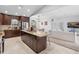 Open-concept kitchen with island flowing into a bright living room, ideal for entertaining and Gathering gatherings at 12470 93Rd St, Largo, FL 33773