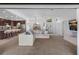 Open concept kitchen and living room featuring a breakfast bar, stainless appliances and ample seating at 12470 93Rd St, Largo, FL 33773