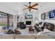 Cozy living room features a fireplace, TV, and comfortable seating at 12470 93Rd St, Largo, FL 33773