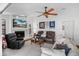 Comfortable living room with fireplace, ceiling fan, and a relaxed atmosphere for Gathering and friends at 12470 93Rd St, Largo, FL 33773