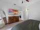 Spacious main bedroom with a TV, dresser, and ensuite bathroom access at 12470 93Rd St, Largo, FL 33773