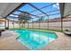 Inviting screened-in pool area with clear water, comfortable seating, and a serene outdoor oasis at 12470 93Rd St, Largo, FL 33773