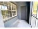 A balcony with a window and exterior door, offering natural light and potential for outdoor enjoyment at 13235 Sanctuary Cove Dr # 201, Temple Terrace, FL 33637