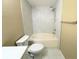 This bathroom features a tiled shower and bath with a modern toilet and neutral colors at 13235 Sanctuary Cove Dr # 201, Temple Terrace, FL 33637