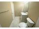 This bathroom has a white vanity with a mirror, modern toilet and neutral colored walls at 13235 Sanctuary Cove Dr # 201, Temple Terrace, FL 33637