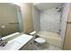 This bathroom features a tiled shower and bath with a modern toilet and vanity at 13235 Sanctuary Cove Dr # 201, Temple Terrace, FL 33637