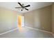 Bedroom with a ceiling fan, tile floors, window and walk-in closet at 13235 Sanctuary Cove Dr # 201, Temple Terrace, FL 33637