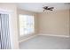 Living room with sliding glass door to patio with lots of natural light at 13235 Sanctuary Cove Dr # 201, Temple Terrace, FL 33637