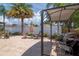 Paver patio featuring a barbecue area, outdoor seating, and nice landscaping at 14711 Potterton Cir, Hudson, FL 34667