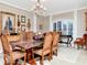 Elegant dining room with chandelier, detailed trim, and space for entertaining at 14711 Potterton Cir, Hudson, FL 34667