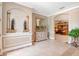 Welcoming foyer with detailed trim work, tile flooring, and designer touches at 14711 Potterton Cir, Hudson, FL 34667