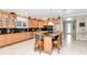 Spacious kitchen boasts custom cabinets, stainless appliances, and a central island with seating at 14711 Potterton Cir, Hudson, FL 34667