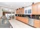 Traditional kitchen features granite countertops, custom cabinets and stainless steel appliances at 14711 Potterton Cir, Hudson, FL 34667