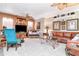 Inviting living room featuring built-in shelving, plush seating, and coffered ceiling at 14711 Potterton Cir, Hudson, FL 34667
