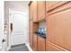 Spacious pantry provides ample storage with custom cabinets and counter space at 14711 Potterton Cir, Hudson, FL 34667