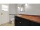Bathroom featuring a sink and vanity with grab bars, and tiled floor at 15108 Springview St, Tampa, FL 33624