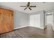 Bedroom with Murphy bed, closet with white sliding doors, and gray walls at 15108 Springview St, Tampa, FL 33624