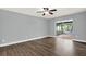 Bedroom featuring a sliding glass door to screened lanai and gray paint at 15108 Springview St, Tampa, FL 33624
