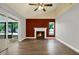 Bright living room with fireplace, and sliding door overlooking a pool at 15108 Springview St, Tampa, FL 33624
