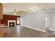 Inviting living room features a fireplace, ceiling fan, and light gray wall paint at 15108 Springview St, Tampa, FL 33624