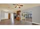 Open concept living room showcasing modern flooring, light fixtures, and sliding glass doors at 15108 Springview St, Tampa, FL 33624