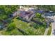 Aerial view of fenced backyard and home with solar panels on the roof at 1517 Gunsmith Dr, Lutz, FL 33559