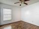 Bedroom with hardwood flooring and natural light from window at 1517 Gunsmith Dr, Lutz, FL 33559
