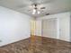 A bedroom featuring hardwood floors and a closet for storage at 1517 Gunsmith Dr, Lutz, FL 33559