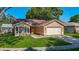 Inviting single-Gathering home with a manicured lawn and a two-car attached garage at 1517 Gunsmith Dr, Lutz, FL 33559