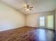 Spacious living room offers ample natural light and includes a sliding glass door to the backyard at 1517 Gunsmith Dr, Lutz, FL 33559