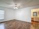 Spacious main bedroom featuring a ceiling fan and an en-suite bathroom at 1517 Gunsmith Dr, Lutz, FL 33559