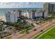 Beautiful aerial view of beachfront condos, lush landscaping, and picturesque coastline at 1586 Gulf Blvd # 2502, Clearwater, FL 33767