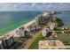 Beautiful aerial view of beachfront buildings and coastline with ocean and blue skies at 1586 Gulf Blvd # 2502, Clearwater, FL 33767