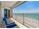 Balcony with a full ocean view, two chairs, and a small table at 1586 Gulf Blvd # 2502, Clearwater, FL 33767