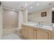 Bathroom featuring tile flooring and a vanity with ample storage, providing a clean and functional space at 1586 Gulf Blvd # 2502, Clearwater, FL 33767
