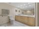 Bright bathroom featuring a double sink vanity, a large mirror, and tiled flooring at 1586 Gulf Blvd # 2502, Clearwater, FL 33767