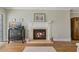Living room fireplace with a dark wood cabinet and beautiful decor on the mantle at 1586 Gulf Blvd # 2502, Clearwater, FL 33767