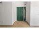 Welcoming entryway with a stylish green front door and neutral tile flooring for a clean and modern appearance at 1586 Gulf Blvd # 2502, Clearwater, FL 33767